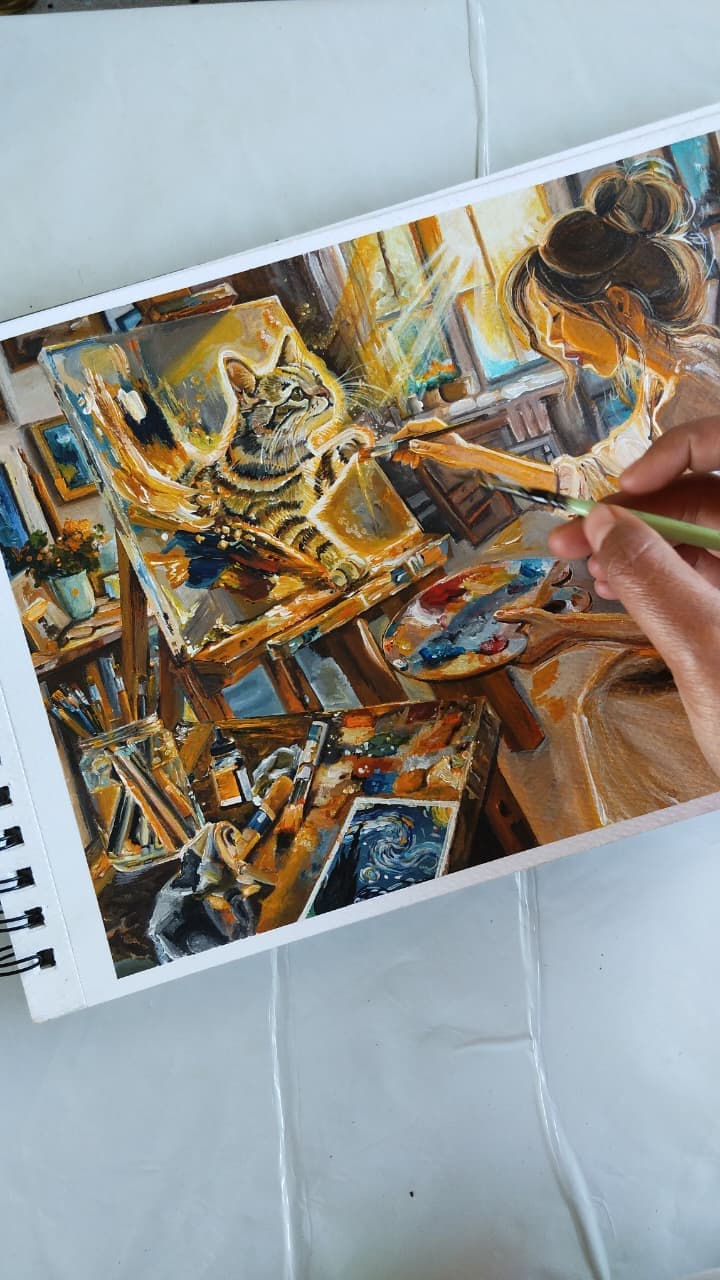 Artist painting a cat in a bright studio