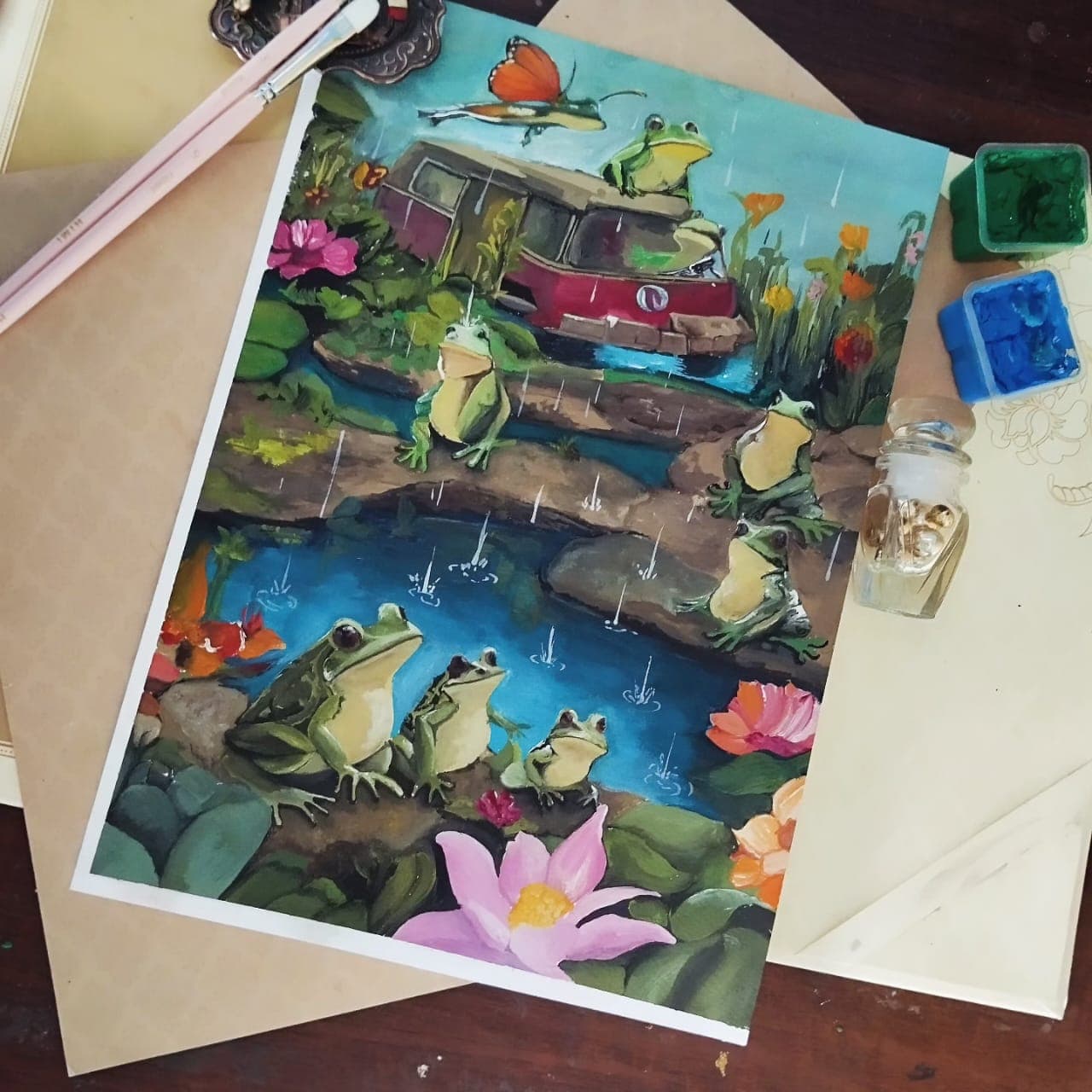 Painting of frogs beside a pond