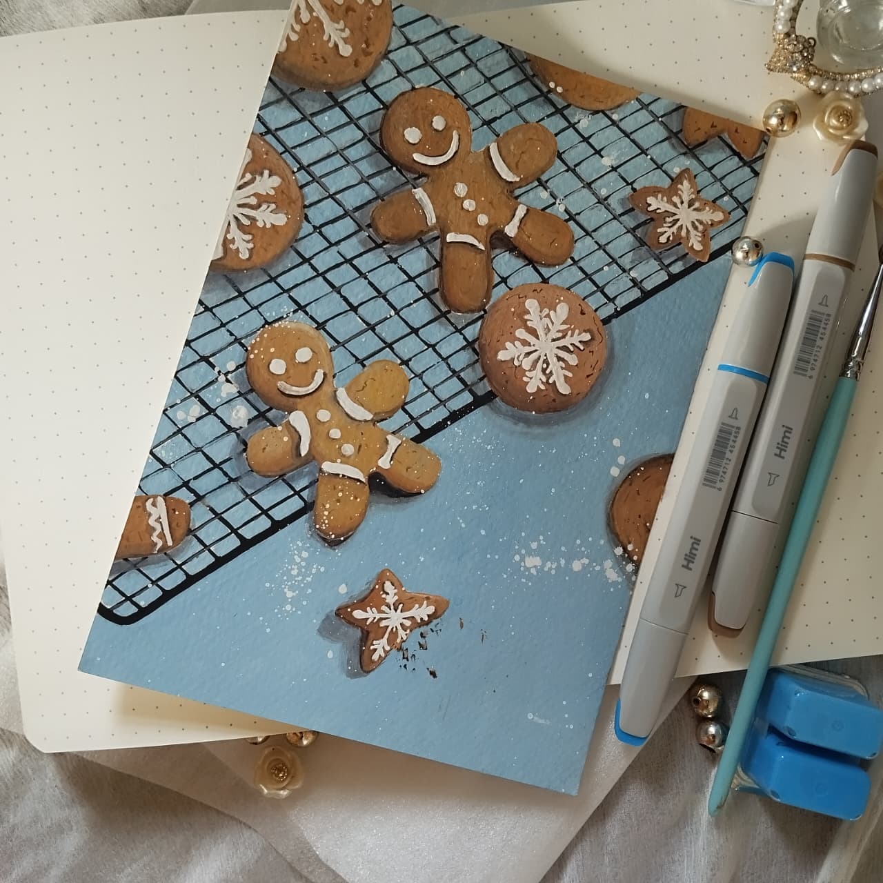 Painting of gingerbread figures and cookies